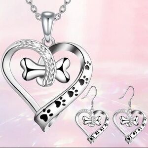 Silver tone, dog paw and bone necklace and earring set